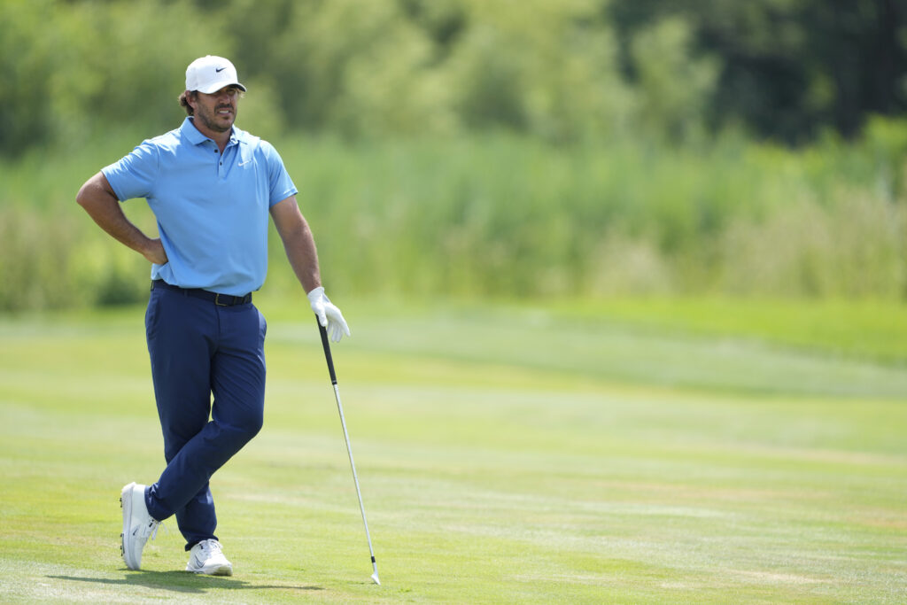 Brooks Koepka waits on the fairway during the first round of LIV Golf Chicago