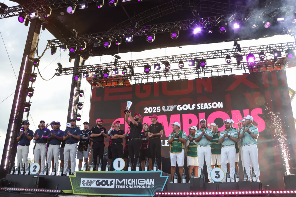 Jon Rahm lifts the trophy after Legion XIII's victory at the LIV Golf Team Championship