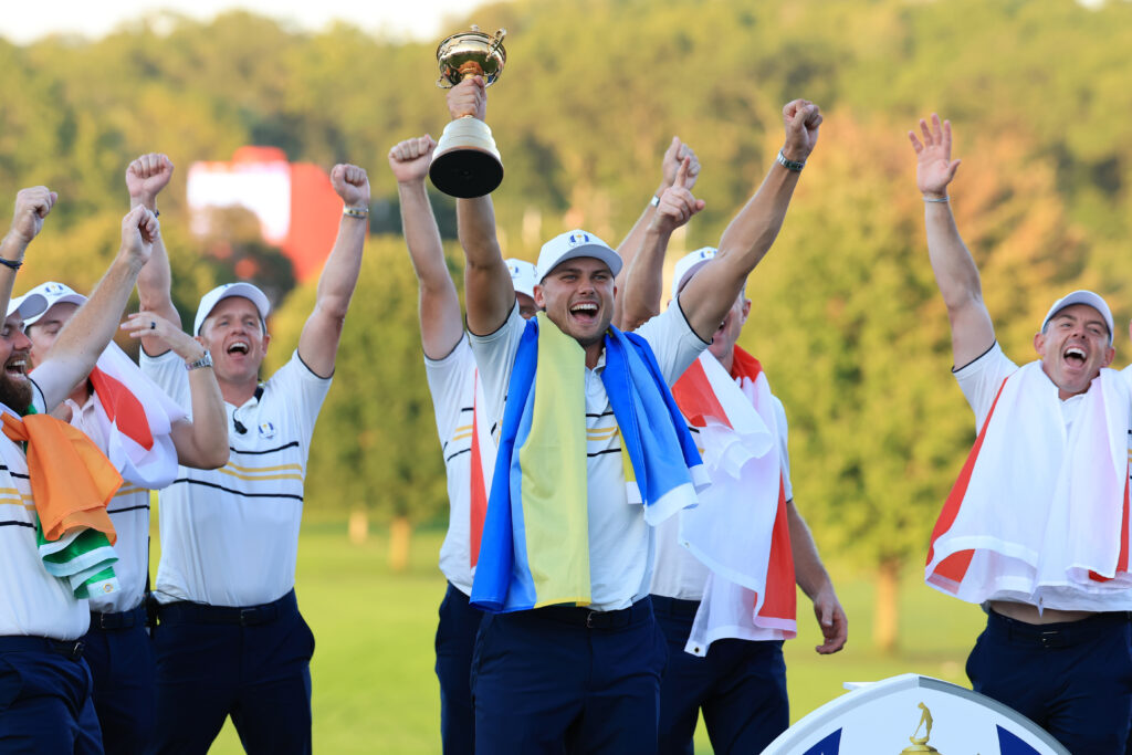 Ludvig Aberg lifts the Ryder Cup trophy after Europe's victory in New York