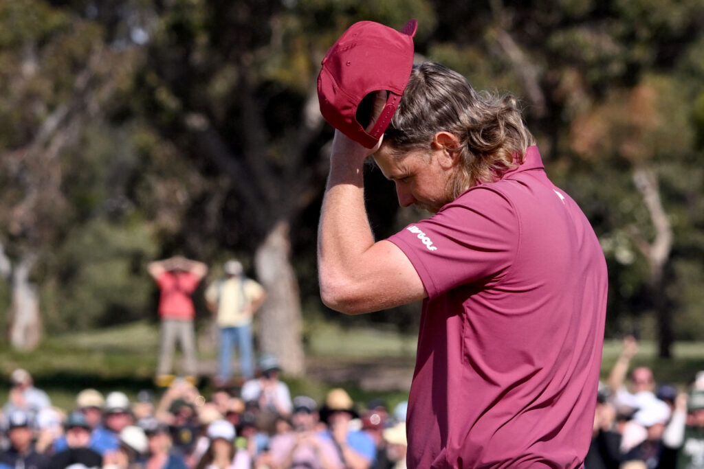Cam Smith reacts to missing a putt on the 18th green during the final round of the Australian Open