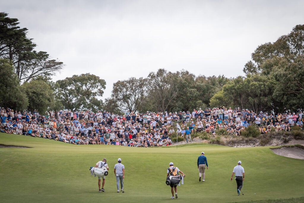 Min Woo Lee of Australia, Adam Scott of Australia and Rory McIlroy of Northern Ireland walk towards the 5th green on day one of the Crown Australian Open 2025