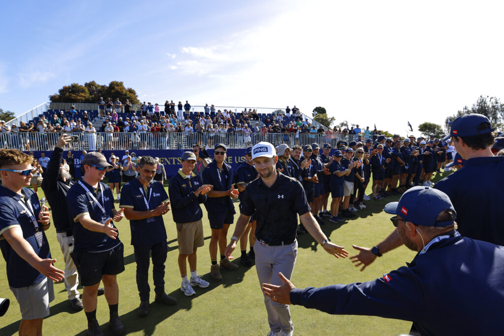 Rasmus Neergaard-Petersen walks onto the green to celebrate winning the Australian Open