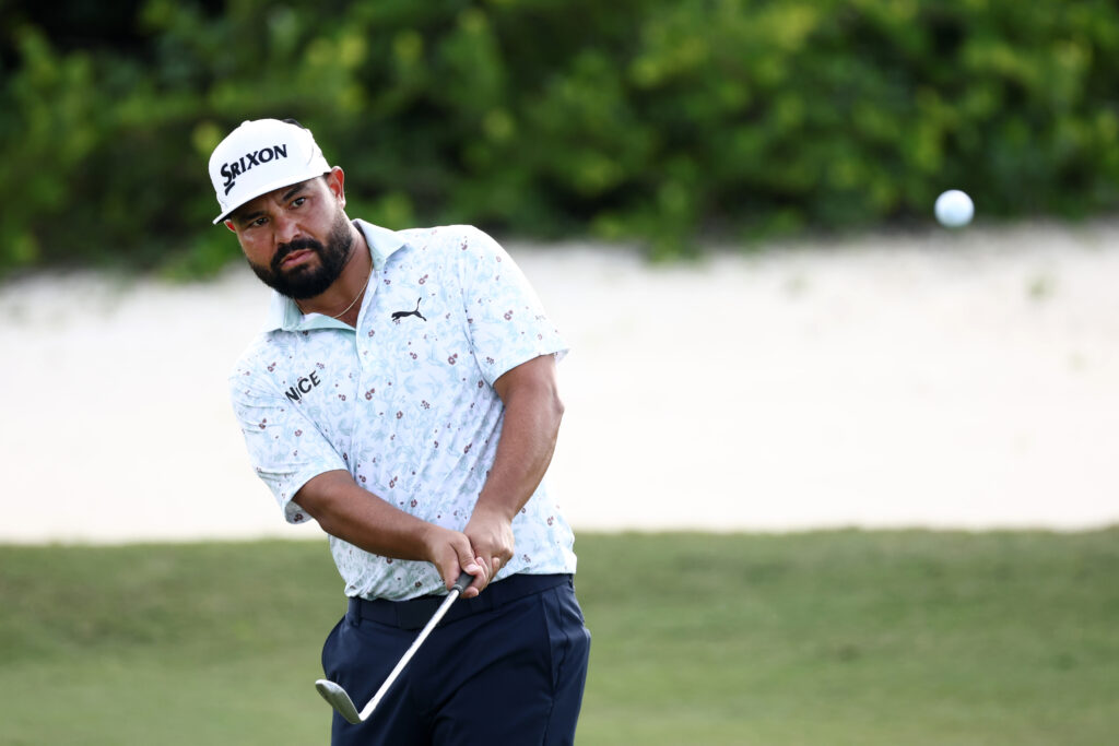 J.J. Spaun hits a chip shot during the first round of the Hero World Challenge