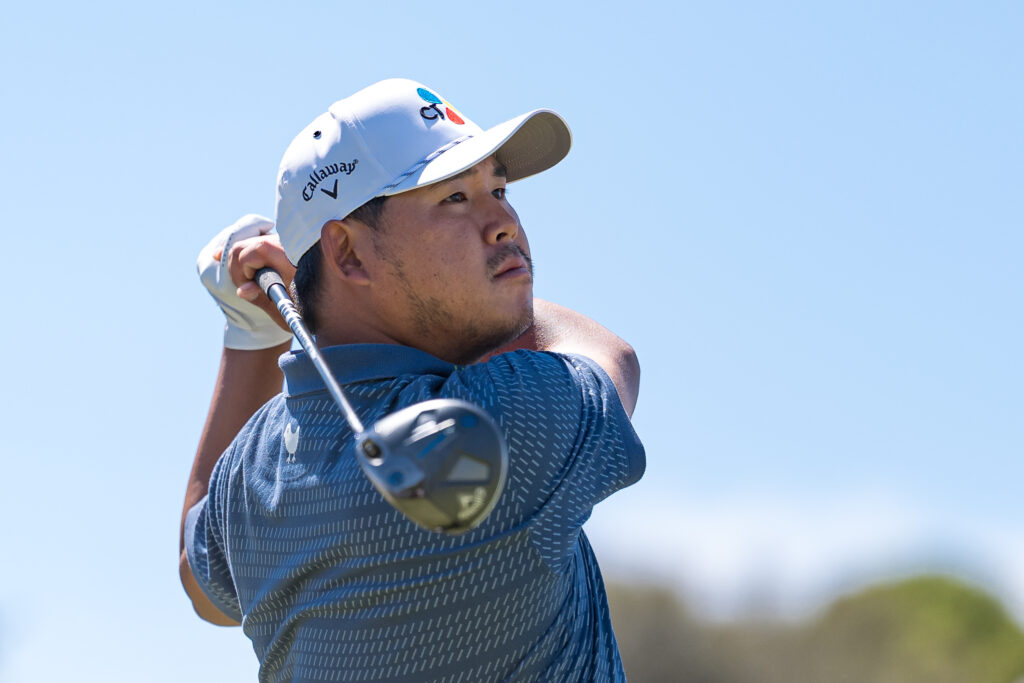 Si Woo Kim of Korea plays his tee shot on the 13th tee on day four of the Crown Australian Open 2025
