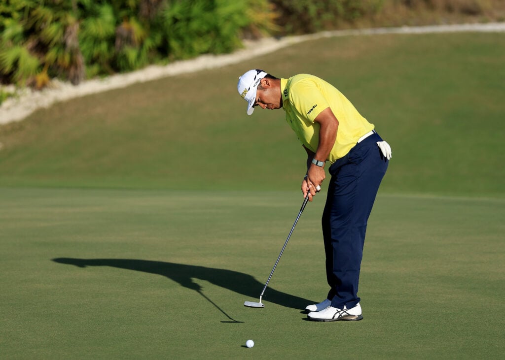 Hideki Matsuyama hits a putt on the 16th hole during the last round of the Hero World Challenge