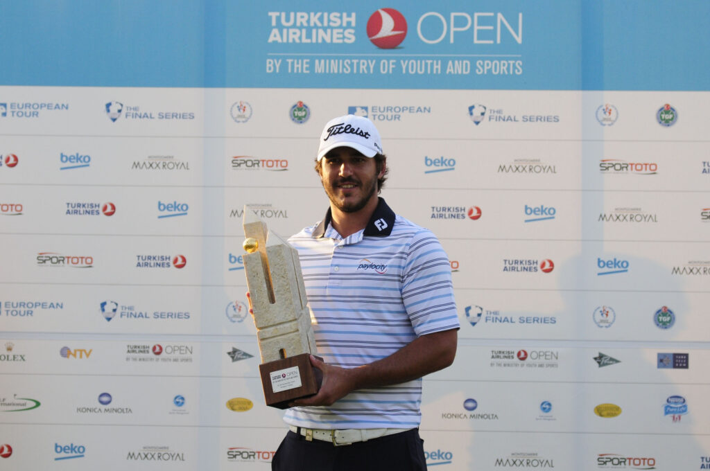 Brooks Koepka lifts the trophy after winning the 2014 Turkish Airlines Open