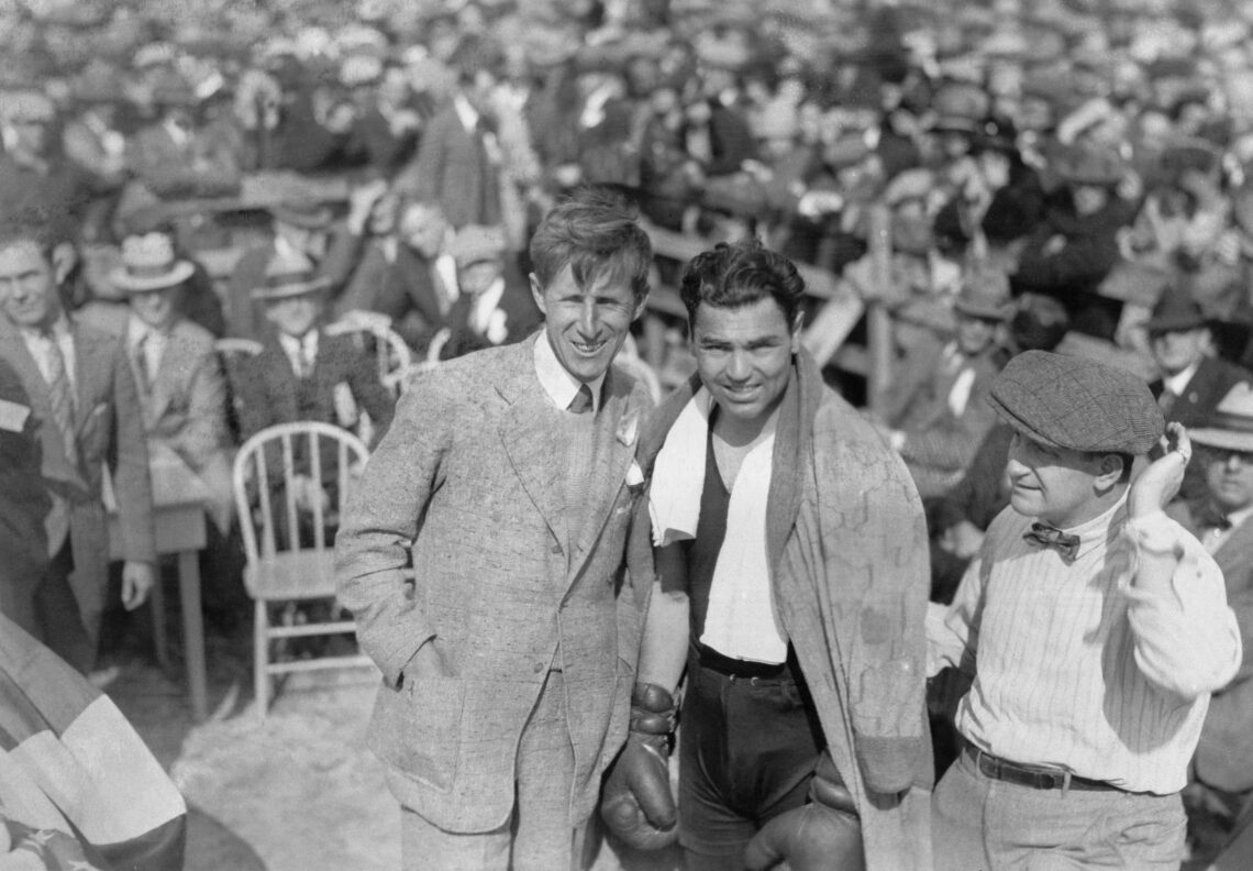 (Original Caption) Champions of the links and mitts...Very rarely do world famous world champions get together, but here are a famous pair, Jim Bar...
