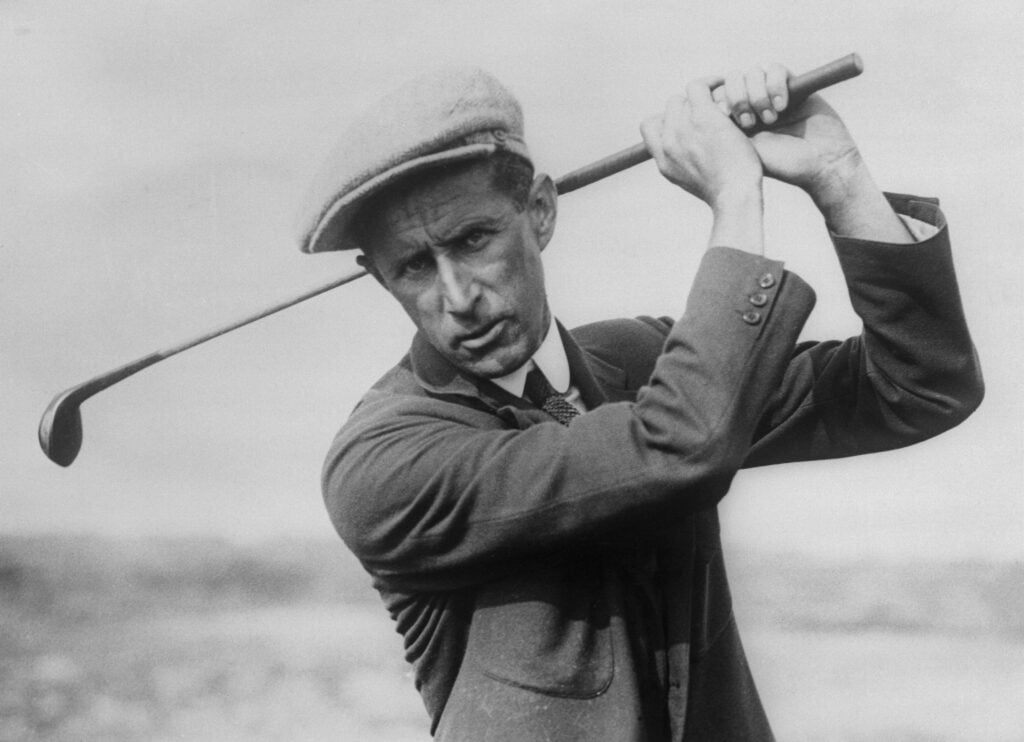 Jim Barnes Holding a Golf Club