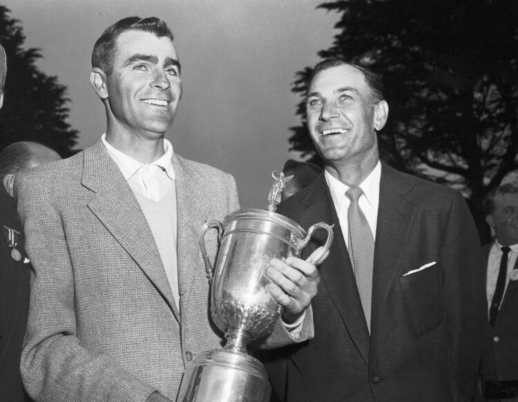 (Original Caption) Jack Fleck, 32-year-old pro from Davenport, IA, looks mighty pleased as he holds the gleaming trophy after winning the National ...