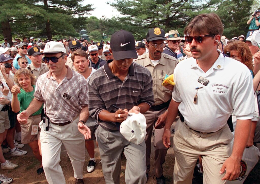 Tiger Woods leaving the final green following a practice round ahead of the 1997 US Open