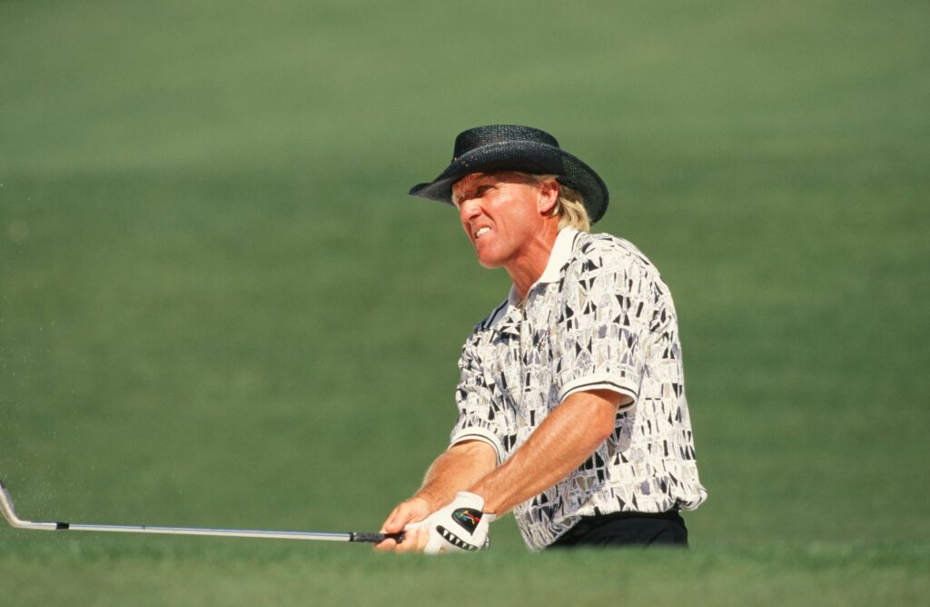 Greg Norman hits a shot during the 1996 Masters