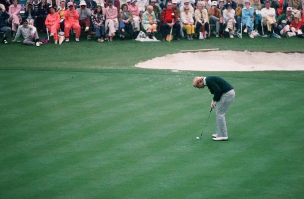 Jack Nicklaus stands over a putt during the 1975 Masters