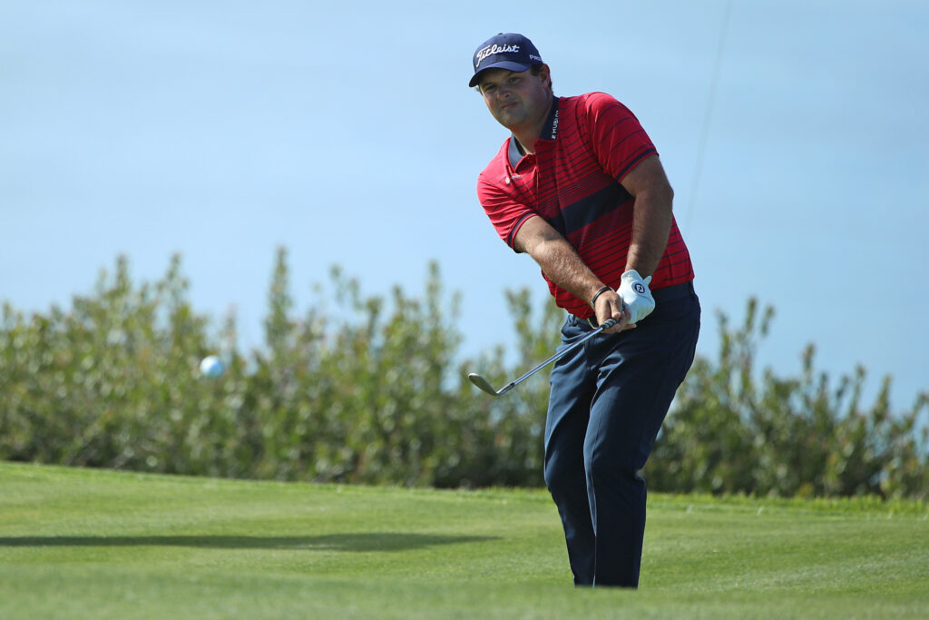 Patrick Reed chips onto the green during the final round of the Farmers Insurance Open