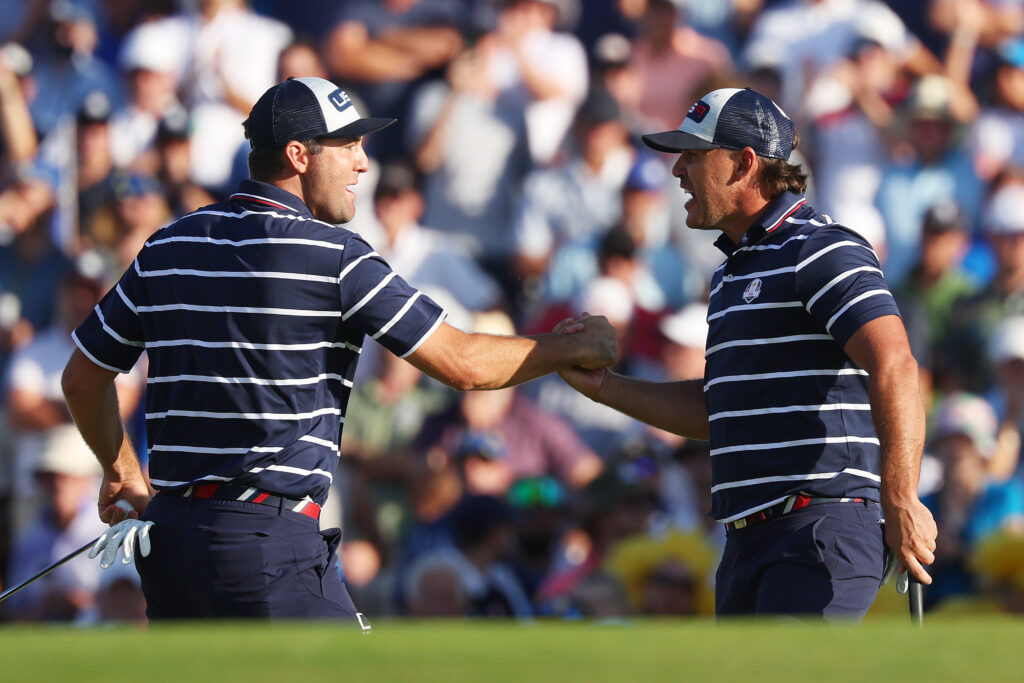 Brooks Koepka and Scottie Scheffler of Team United States celebrate on the 15th green during the Friday afternoon fourball matches of the 2023 Ryder Cup at Marco Simone Golf Club on September 29, 2023