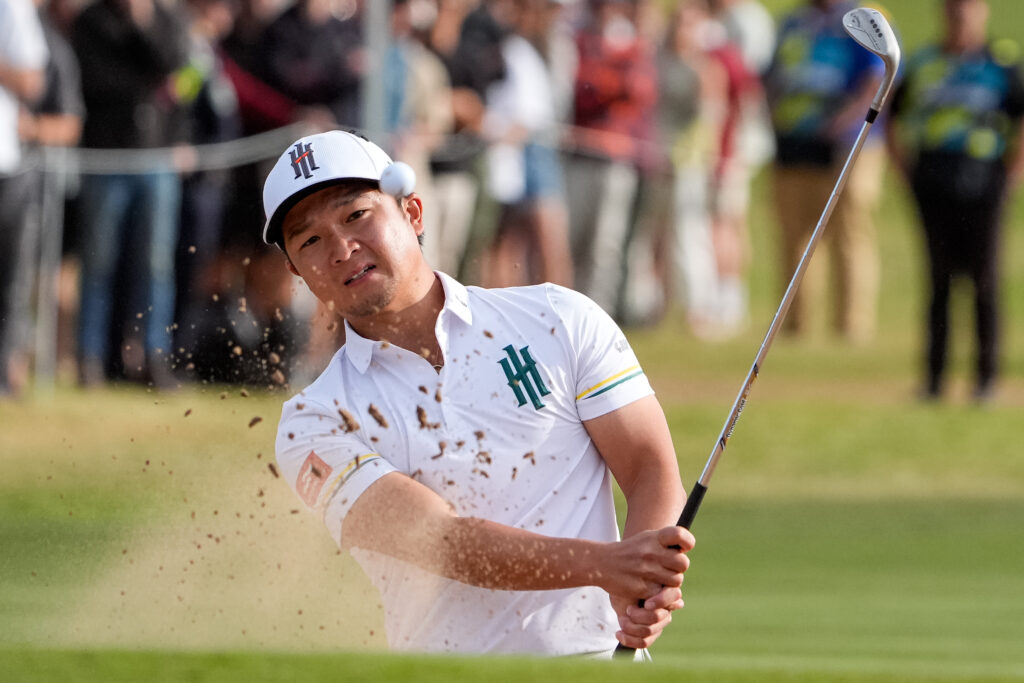 Jinichiro Kozuma of Iron Heads GC plays out of the bunker on the 18th hole during LIV Adelaide