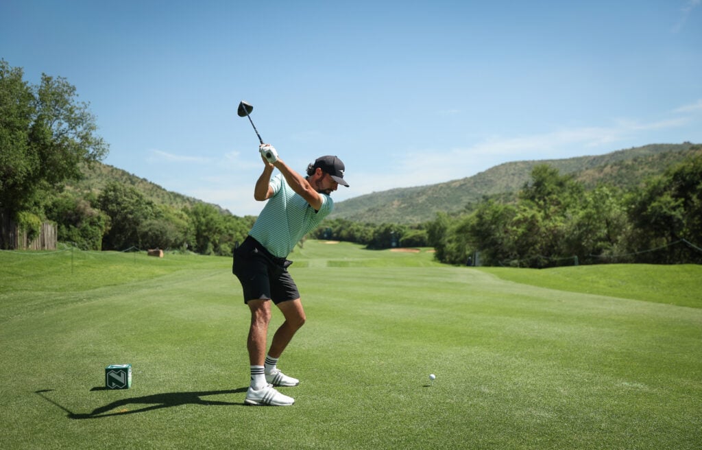 Marco Penge of England in action prior to the Nedbank Golf Challenge in honour of Gary Player 2026