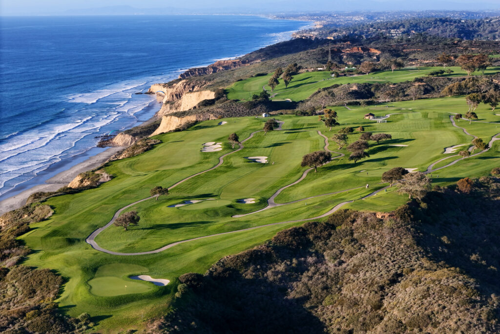 In an aerial view, the Torrey Pines Municipal Golf Course, a city owned course is shown at sunset above the bluffs of Black's Beach