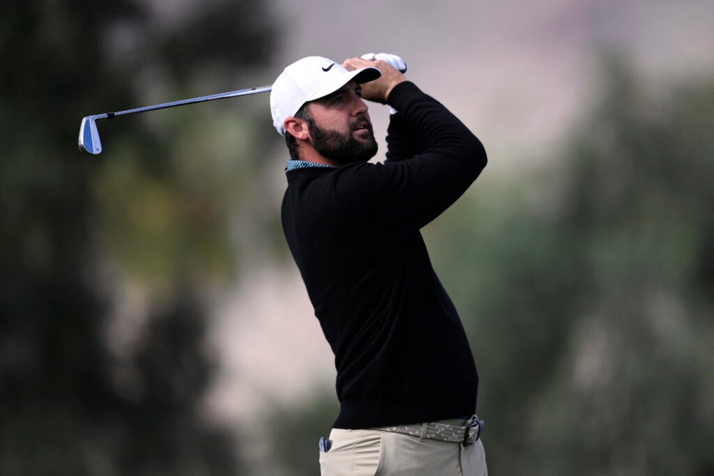 Scottie Scheffler hits a tee shot during the first round of The American Express