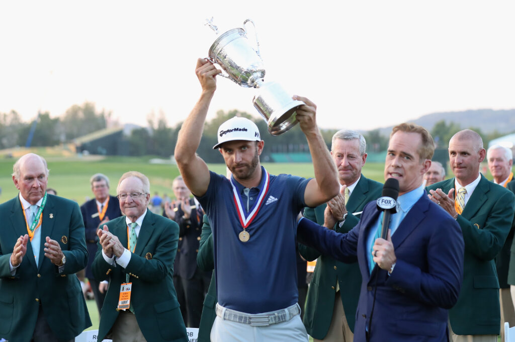 Dustin Johnson lifts the US Open trophy after his victory in 2016