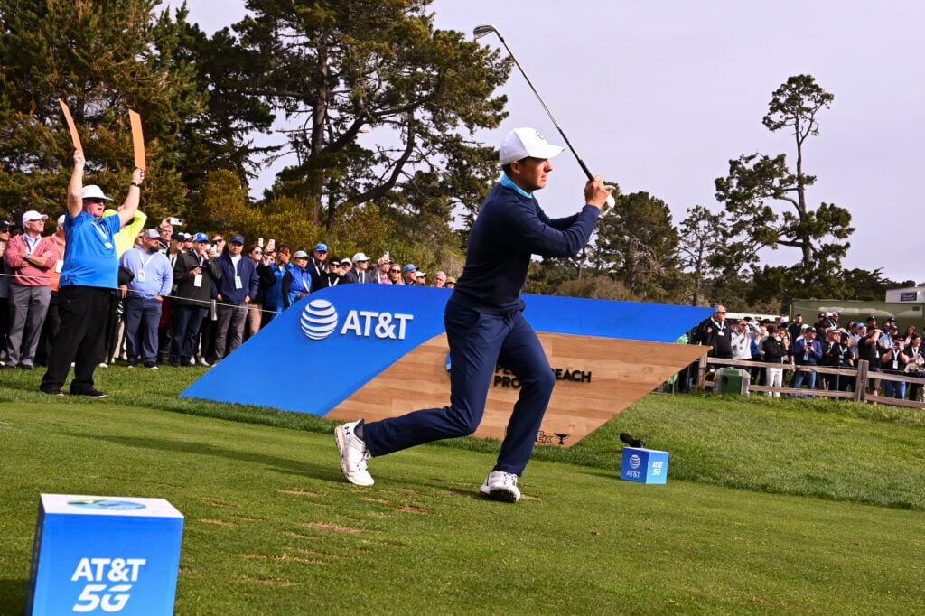 Jordan Spieth reacting after a tee shot that will force him into using one of his signature creative recovery shots during the 2023 Pebble Beach Pro-Am, illustrating his role as golf's most unpredictable entertainer.