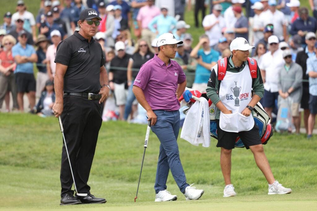 Phil Mickelson and Xander Schauffele on the fifth green during the second round of the 2021 U.S. Open at Torrey Pines Golf Course.