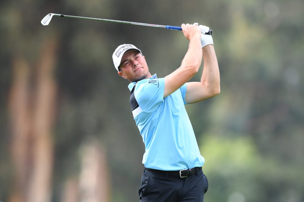 Viktor Hovland hits his approach shot into the 11th green during the final round of the Genesis Invitational at Riviera Country Club in 2024.
