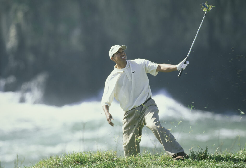 Tiger Woods hits a shot from the rough during the 2000 AT&T Pebble Beach Pro-Am