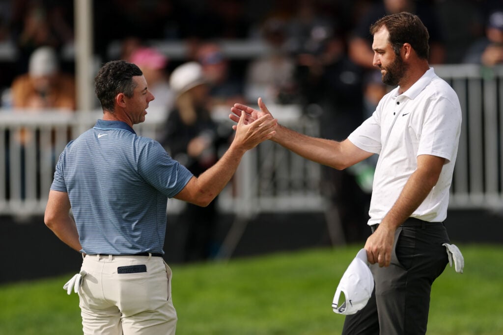 Rory McIlroy and Scottie Scheffler shake hands on the 18th green after the final round of The Genesis Invitational at Torrey Pines in 2025.