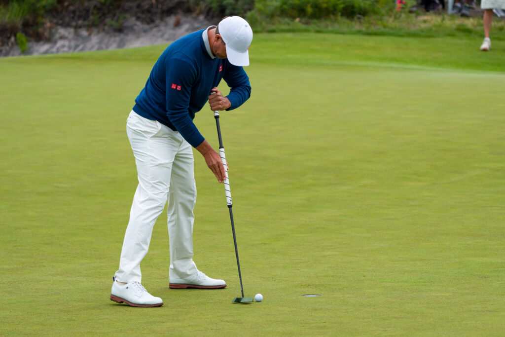 Adam Scott hits a putt during the third round of the Australian Open