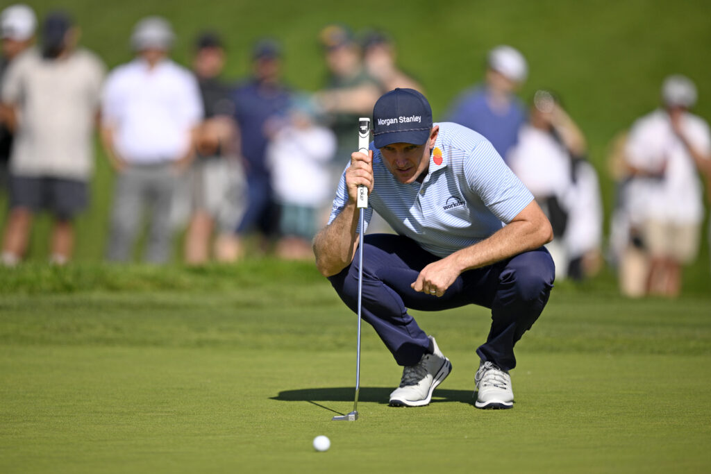 Justin Rose lines up a putt during the third round of the Farmers Insurance Open