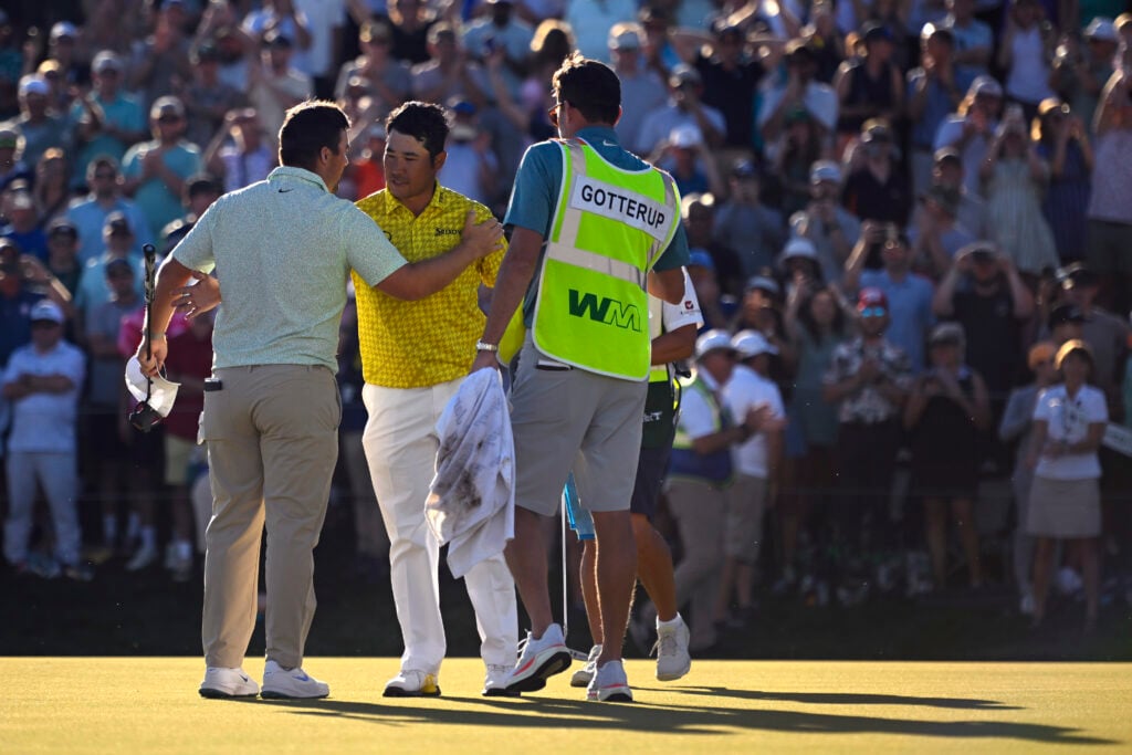 Chris Gotterup and Hideki Matsuyama on the 18th green of the first playoff hole after winning the WM Phoenix Open