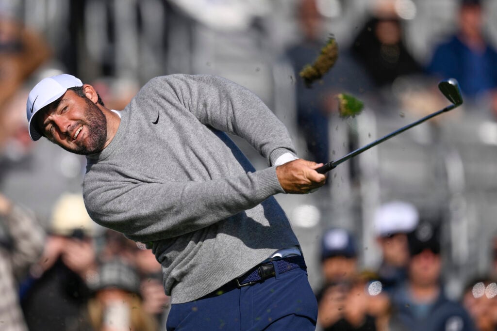 Scottie Scheffler hits his tee shot on the 17th tee during the 2026 AT&T Pebble Beach Pro-Am opening round.