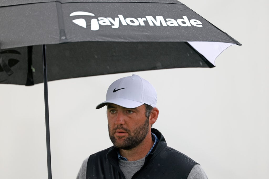 Scottie Scheffler takes shelter under his umbrella on the 11th hole during the final round of the AT&T Pebble Beach Pro-Am 2026.