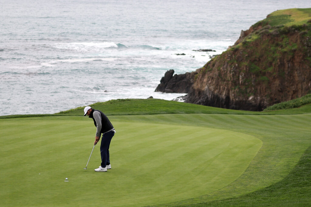 Scottie Scheffler holes his putt on 8 during the final round of the AT&T Pebble Beach Pro-Am