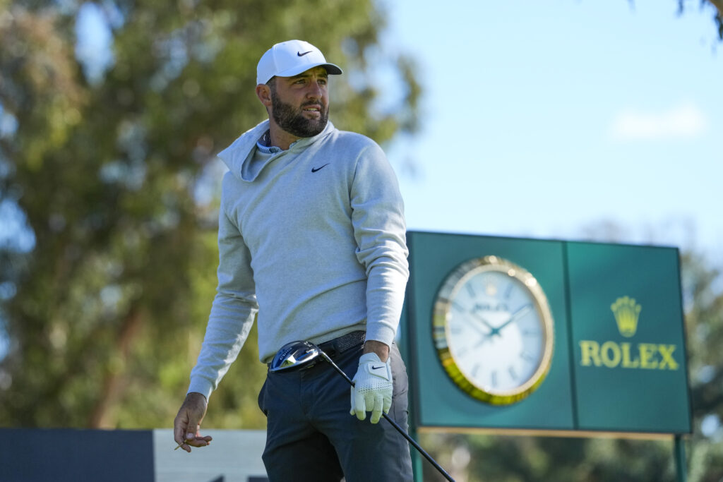 Scottie Scheffler watches his tee shot on the 15th hole during a pro-am prior to the The Genesis Invitational at Riviera