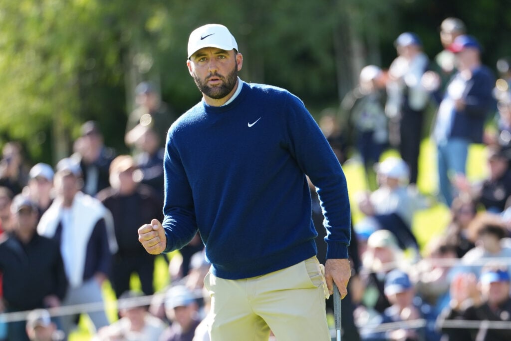 Scottie Scheffler fist pumps on the 18th green during the second round of The Genesis Invitational at The Riviera