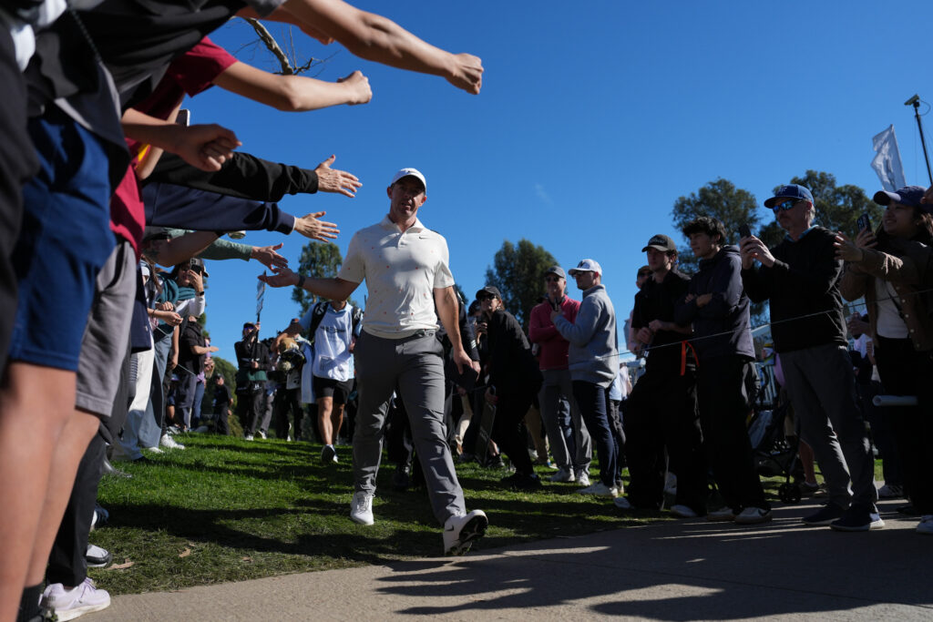 Rory McIlroy embraces the fans during the third round of the Genesis Invitational at Riviera
