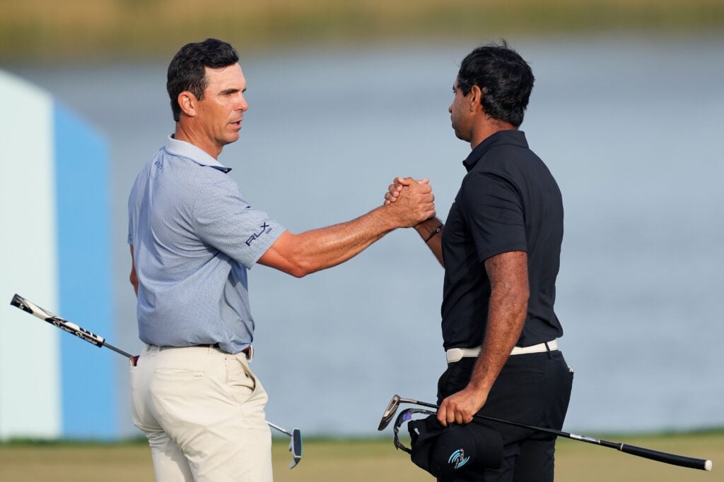 Billy Horschel of the United States and Aaron Rai of England shake hands on the 18th green during the second round of the Cognizant Classic