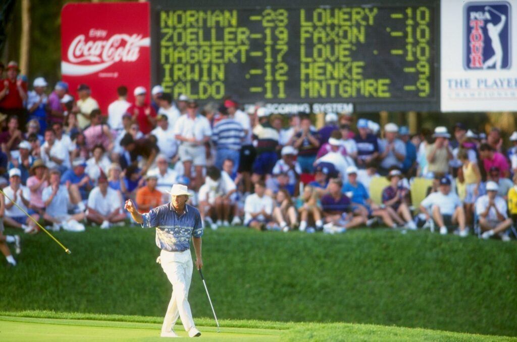 Greg Norman sinks a birdie putt on the 17th hole during the 1994 Players Championship at the TPC Sawgrass