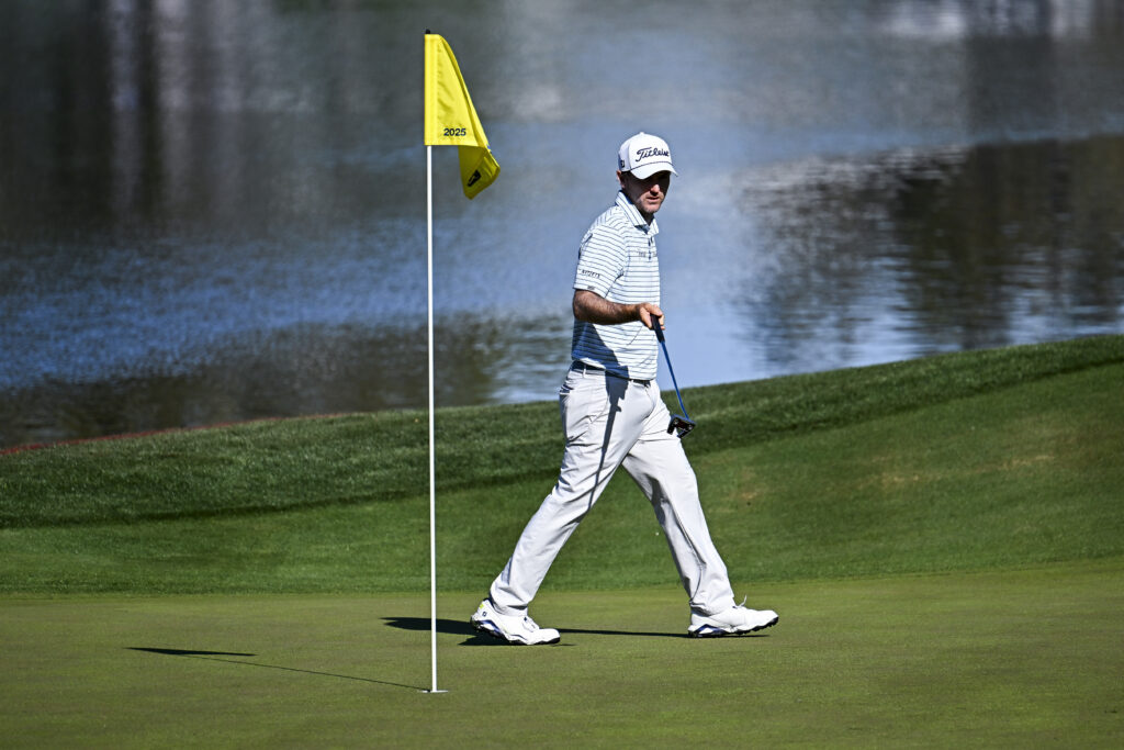 Russell Henley reading a putt during the first round of The Players Championship in 2025
