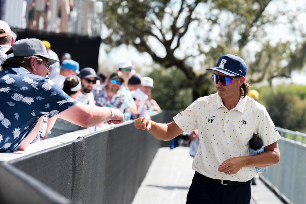Rickie Fowler walks to the 16th tee high-fiving fans during the second round of Arnold Palmer Invitational Bay Hill