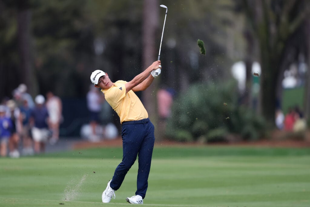 Collin Morikawa hits his approach into the first hole at The Players