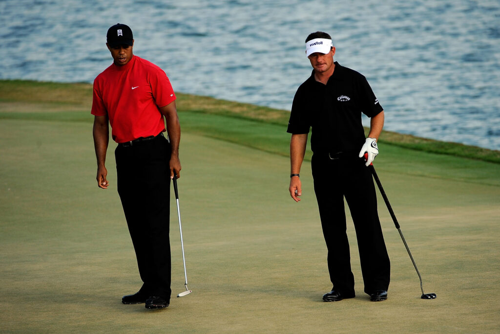 Tiger Woods and Alex Cejka on the 18th green during the final round of the 2009 Players Championship