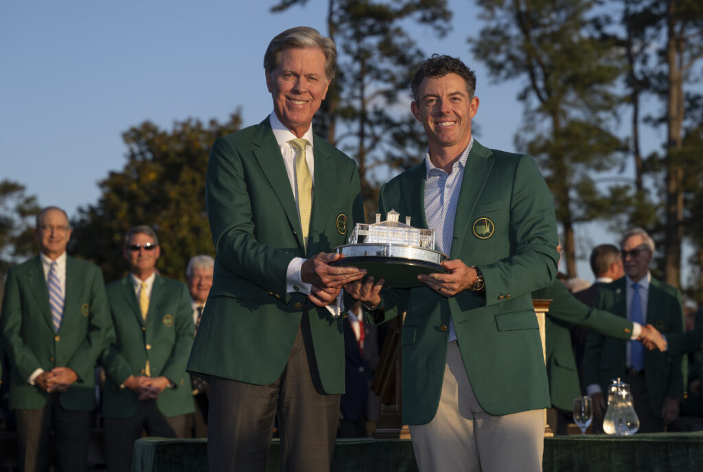 Chairman of Augusta National Golf Club and the Masters Tournament Fred S. Ridley presents Masters champion Rory McIlroy of Northern Ireland the Masters Trophy
