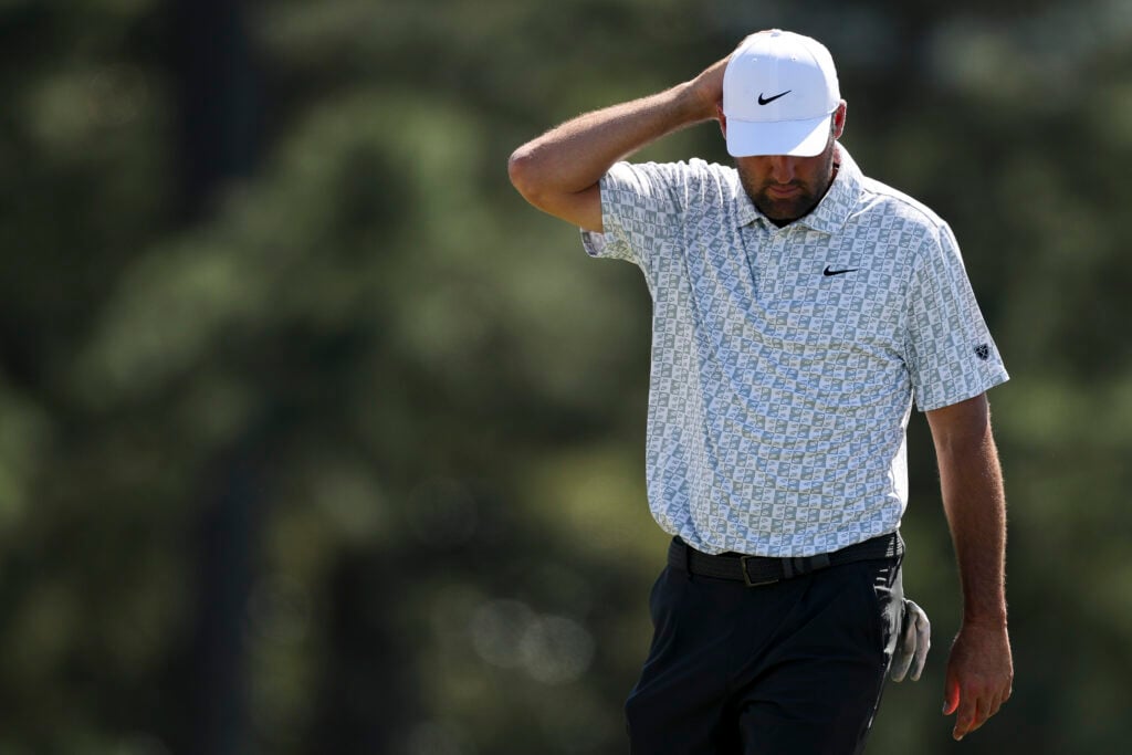 Scottie Scheffler of the United States reacts on the 18th green during the second round of the 2026 Masters Tournament at Augusta National Golf Club