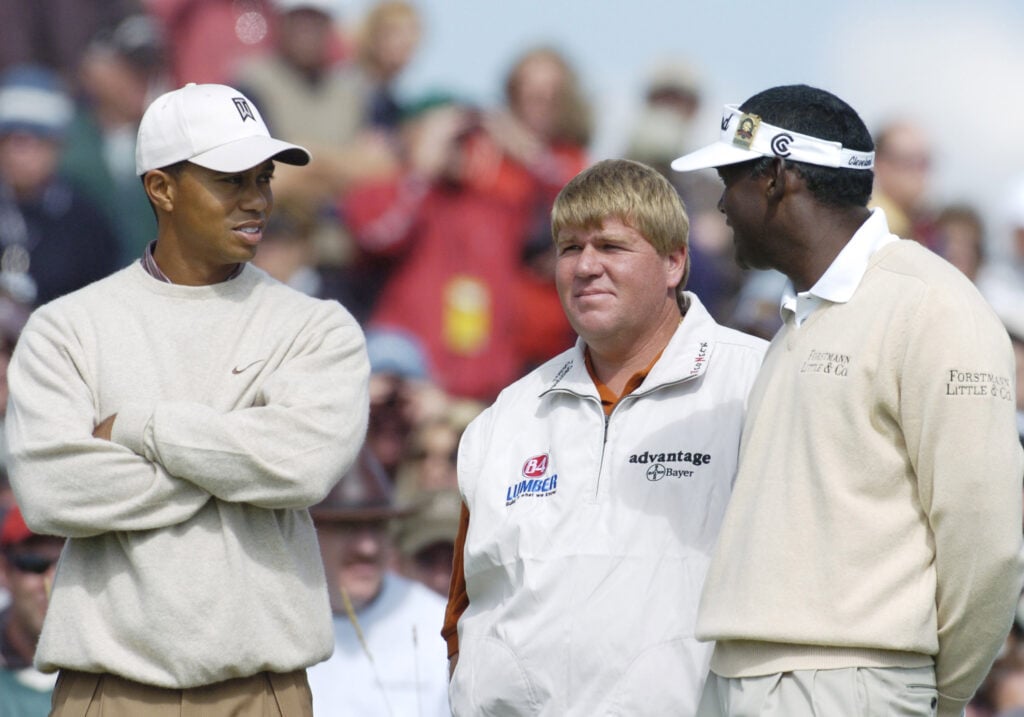 Tiger Woods, John Daly and V. J. Singh talk on the 17th tee at Whistling Straits, site of the 86th PGA Championship