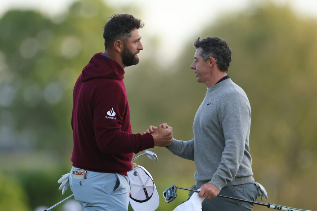 Jon Rahm and Rory McIlroy shake hands after the second round of the PGA Championship