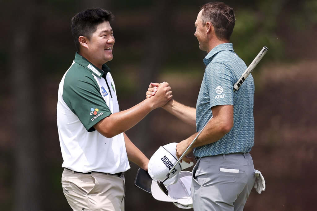 Sungjae Im of South Korea and Jordan Spieth of the United States shake hands on the ninth hole green after finishing the second round of THE CJ CUP Byron Nelson