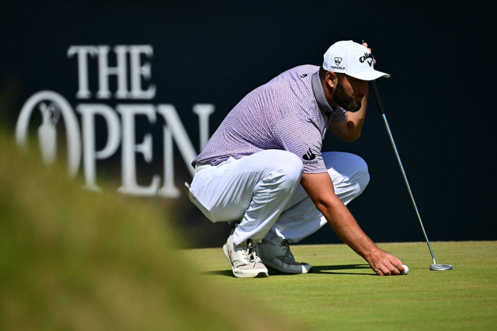 Spain's Jon Rahm replaces his ball on the 12th green on day four of the 154th Open Golf championship at Royal Birkdale